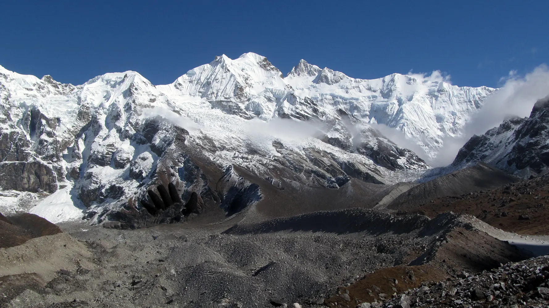 Panoramic view of snow-covered Kanchenjunga from Goechala Trek Viewpoint 1 in Sikkim
