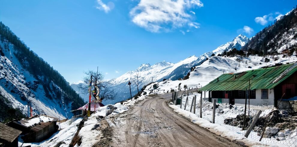 North Sikkim photo a road and house covered in snow
