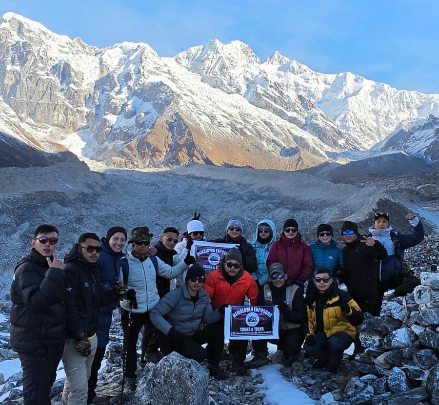 Trekkers crossing a wooden bridge over a mountain river near Uttarey in West Sikkim